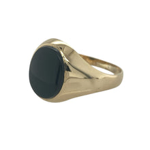 Load image into Gallery viewer, Bring bold contrast and classic style to your collection with this pre-owned 9ct yellow gold onyx signet ring—a timeless design with striking presence.

Design: The ring features an oval onyx stone measuring 11mm by 10mm, creating a strong and distinguished look.
Material: Made from 9-carat yellow gold, the polished finish enhances the deep black of the onyx and adds refined elegance.
Ring Detail: With its bold onyx centre and traditional signet style, this piece balances strength with sophistication.

