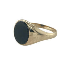 Load image into Gallery viewer, Bring bold contrast and refined style to your collection with this pre-owned 9ct yellow gold onyx signet ring—a classic piece with timeless appeal.

Design: The ring features an oval onyx stone measuring 10mm by 8mm, offering a sleek and distinguished look.
Material: Made from 9-carat yellow gold, the polished finish highlights the deep black of the onyx and adds elegant character.
Ring Detail: With its smooth onyx centre and traditional signet form, this ring combines strength, style, and sophistication.

