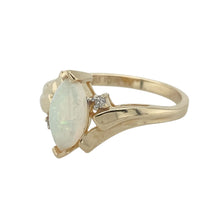 Load image into Gallery viewer, Bring iridescent colour and refined sparkle to your collection with this pre-owned 10ct yellow gold diamond and opalique ring—a distinctive design with timeless elegance.

Design: The ring showcases a 10mm by 5mm oval opalique stone at the centre, accented with diamonds for added brilliance and contrast.
Material: Made from 10-carat yellow gold, the polished finish enhances the warm tone of the gold and the shimmering play of colour in the opalique.

