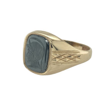 Load image into Gallery viewer, Bring bold character and distinctive style to your collection with this pre-owned 9ct yellow gold hematite centurion signet ring, featuring strong design details and rich contrast—perfect for statement wear or lasting everyday sophistication.

Design: The ring features a rectangular hematite stone measuring 10mm by 8mm, finely detailed with a centurion motif that adds depth, presence, and historic inspiration.

