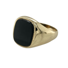 Load image into Gallery viewer, Bring bold elegance and refined contrast to your collection with this pre-owned 9ct yellow gold onyx signet ring, offering timeless style and a confident presence—perfect for statement wear or everyday sophistication.

Design: The ring features a 12mm by 10mm rounded rectangular onyx stone, creating a smooth and striking focal point.
Material: Made from 9-carat yellow gold, the polished finish highlights the deep black tones of the onyx with a warm golden backdrop.

