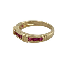 Load image into Gallery viewer, Bring rich colour and refined elegance to your collection with this pre-owned 14ct yellow gold ruby band ring, offering timeless style and a bold splash of red—perfect for both everyday wear and special occasions.

Design: The ring features nine rubies arranged in three rows of three, set into the front of the 4mm wide band for a structured and striking look.

