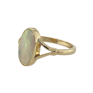 Bring iridescent colour and timeless charm to your collection with this pre-owned 9ct yellow gold opalique ring, offering a graceful design with a luminous finish—perfect for both everyday wear and special occasions.

Design: The ring showcases a 12mm by 6mm oval opalique stone, displaying shifting tones of colour that create a striking and eye-catching focal point.
Material: Made from 9-carat yellow gold, the polished finish provides a warm and classic contrast to the opalique’s shimmering hues.
