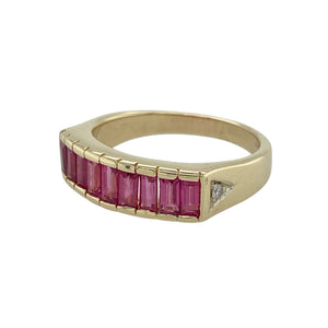 Bring rich colour and refined sparkle to your collection with this pre-owned 9ct yellow gold diamond and ruby band ring, offering timeless elegance with a bold profile—perfect for both everyday wear and special occasions.

Design: The front of the band measures 6mm wide and is set with baguette-cut rubies, accented by a small diamond on each shoulder for subtle brilliance.
Material: Made from 9-carat yellow gold, the polished finish enhances the deep red of the rubies and the sparkle of the diamonds.