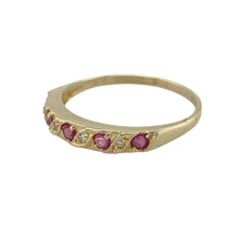 Load image into Gallery viewer, Bring vibrant colour and subtle sparkle to your collection with this pre-owned 9ct yellow gold diamond and ruby band ring, offering timeless style in a delicate design—perfect for everyday wear or as a symbolic keepsake.

Design: The front of the band measures 3mm wide and is set with alternating round diamonds and rubies, creating a balanced pattern of brilliance and rich red tones.
