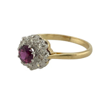 Load image into Gallery viewer, Bring rich colour and sparkling elegance to your collection with this pre-owned 9ct yellow gold diamond and ruby cluster ring, offering timeless charm and refined detail—perfect for special occasions or everyday sophistication.

Design: The ring features a 5mm round ruby at the centre, surrounded by a cluster of diamonds that enhance the gemstone’s vibrant red hue with brilliant contrast.
 
