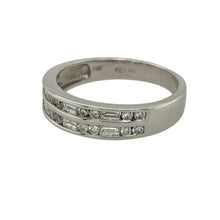 Load image into Gallery viewer, Bring refined sparkle and timeless sophistication to your collection with this pre-owned 18ct white gold diamond band ring, offering classic elegance in a versatile design—perfect for both everyday wear and special occasions.

Design: The front of the band measures 5mm wide and is set with a combination of baguette and brilliant-cut diamonds, creating a striking play of light and texture.

