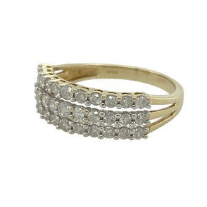 Bring bold sparkle and timeless style to your collection with this pre-owned 9ct yellow gold diamond triple row band ring, offering elegant detail with a statement finish—perfect for both everyday wear and special occasions.

Design: The front of the band measures 7mm wide and is set with three rows of sparkling diamonds, creating a bright and eye-catching display.
Material: Made from 9-carat yellow gold, the polished finish enhances the warmth of the gold while complementing the brilliance of the diamonds.