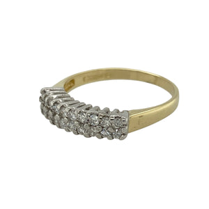 Bring refined sparkle and timeless luxury to your collection with this pre-owned 18ct yellow gold and platinum diamond band ring, offering elegant detail in a versatile design—perfect for both everyday wear and special occasions.

Design: The front of the band measures 4mm wide and is set with two rows of diamonds, creating a balanced display of brilliance across the surface.
