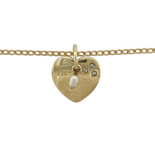 Load image into Gallery viewer, Bring romantic charm and timeless elegance to your collection with this pre-owned 9ct yellow gold heart pendant set with diamond and pearl on a 20&quot; curb chain, offering symbolic beauty with a refined finish—perfect as a meaningful gift or everyday keepsake.

Design: The pendant measures 1.6cm long including the bail and features a delicate heart motif adorned with a single pearl and accented by sparkling diamonds.

