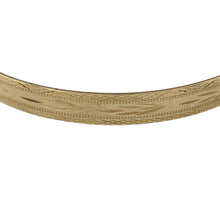 Load image into Gallery viewer, Bring bold elegance and timeless detail to your collection with this pre-owned 9ct yellow gold patterned bangle, offering a substantial design with classic style—perfect for statement wear or everyday sophistication.

Design: The bangle measures 6.7cm in diameter with a 6mm width, detailed with an intricate patterned finish that adds texture and character.
Material: Made from solid 9-carat yellow gold, the polished surface enhances the warm tone and highlights the decorative detail.

