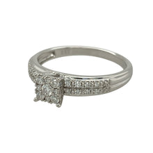 Load image into Gallery viewer, Bring brilliance and sophistication to your collection with this pre-owned 9ct white gold diamond cluster solitaire ring, combining timeless sparkle with a bold princess-style design—perfect for both everyday elegance and special occasions.

Design: The ring features a princess-style cluster arrangement with multiple diamonds, creating the appearance of a larger central stone for maximum impact.

