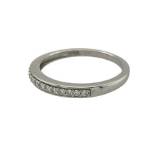 Load image into Gallery viewer, Add subtle sparkle and elegance to your collection with this pre-owned 9ct white gold diamond band ring, a refined piece perfect for stacking, everyday wear, or marking a special occasion.

Design: The ring features a slim band with a row of sparkling diamonds along the front, offering understated brilliance in a timeless style.
Material: Made from 9-carat white gold, the polished finish provides a sleek and modern backdrop to enhance the diamonds’ natural sparkle.

