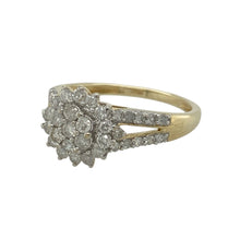 Load image into Gallery viewer, Add sparkle and sophistication to your collection with this pre-owned 9ct yellow gold diamond cluster ring, featuring elegant detailing and impressive brilliance—perfect for statement wear or celebrating special occasions.

Design: The ring showcases a central diamond cluster enhanced by diamond-set split shoulders, creating a balanced and eye-catching look.
Material: Made from 9-carat yellow gold, the polished finish provides warmth and radiance, complementing the sparkle of the diamonds.
