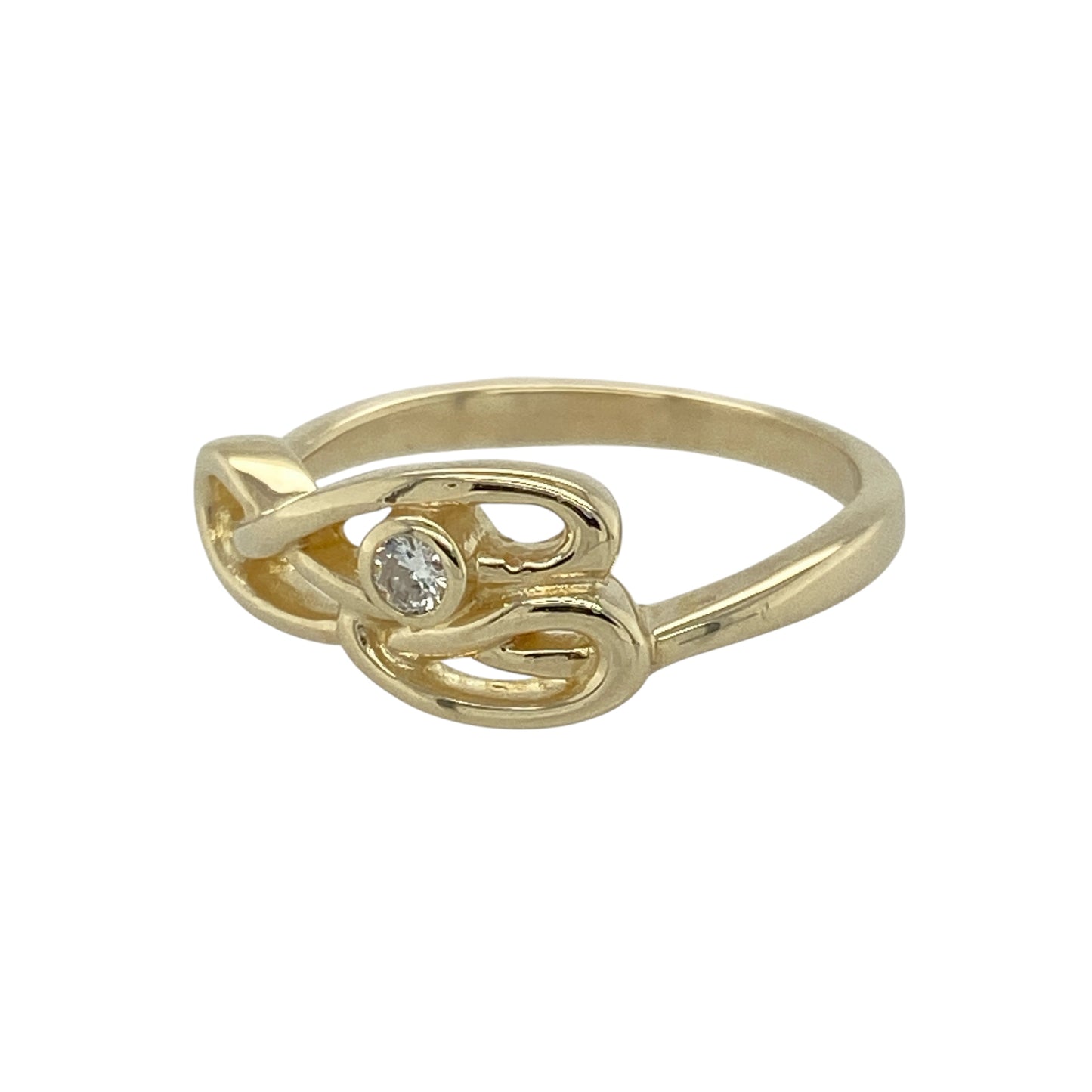Bring heritage design and subtle sparkle to your jewellery collection with this pre-owned 9ct yellow gold Clogau Celtic swirl ring, featuring elegant curves and diamond accents—perfect for everyday elegance with symbolic meaning.

Design: The ring showcases a flowing Celtic swirl motif, measuring 8mm high at the front, accented with diamonds to highlight the graceful lines and traditional influence.