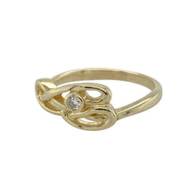 Load image into Gallery viewer, Bring heritage design and subtle sparkle to your jewellery collection with this pre-owned 9ct yellow gold Clogau Celtic swirl ring, featuring elegant curves and diamond accents—perfect for everyday elegance with symbolic meaning.

Design: The ring showcases a flowing Celtic swirl motif, measuring 8mm high at the front, accented with diamonds to highlight the graceful lines and traditional influence.

