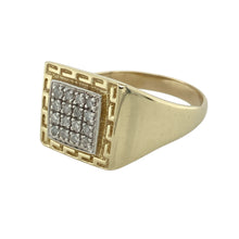Load image into Gallery viewer, Make a bold impression with this pre-owned 9ct yellow gold diamond signet ring, featuring a striking design with classic detailing—perfect for statement wear or special occasions.

Design: The ring showcases a 14mm high front set with sparkling diamonds at the centre, framed by a distinctive Greek key pattern for added style and character.
Material: Made from 9-carat yellow gold, the polished finish enhances the bold design while ensuring lasting shine and durability.

