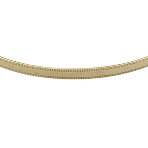 Bring subtle elegance to your collection with this pre-owned 9ct yellow solid gold patterned bangle, a lightweight yet timeless accessory—perfect for everyday wear or stacking with other bangles.

Design: The bangle features a fine milgrain edge patterned finish, adding delicate texture and detail to a classic style.
Material: Made from solid 9-carat yellow gold, the polished surface enhances the warm tone and ensures lasting shine.

