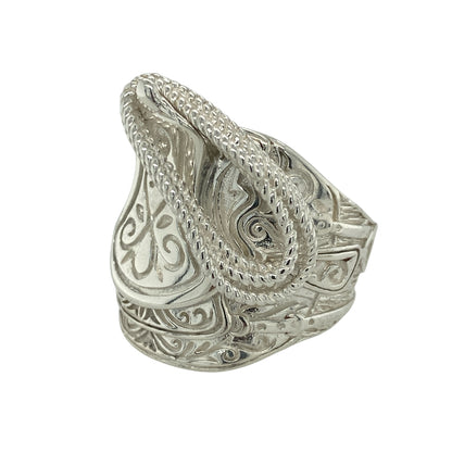 Make a bold statement with this new 925 solid silver saddle ring, a heavyweight design with detailed craftsmanship—perfect for those who love standout jewellery.

Design: The ring features a wide saddle front with intricate patterned detailing, measuring 29mm high for striking presence on the hand.
Material: Made from solid 925 sterling silver, the polished finish enhances durability while highlighting the ornate design.