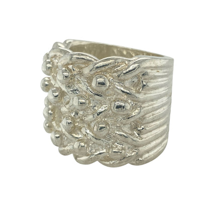 Make an unforgettable statement with this new 925 solid silver four row keeper ring, a heavyweight design with bold presence—perfect for collectors and those who love standout jewellery.

Design: The ring showcases four raised rows across the front, measuring an impressive 28mm high, creating a strong and commanding look.
Material: Made from solid 925 sterling silver, the polished finish enhances durability while highlighting the bold keeper style.