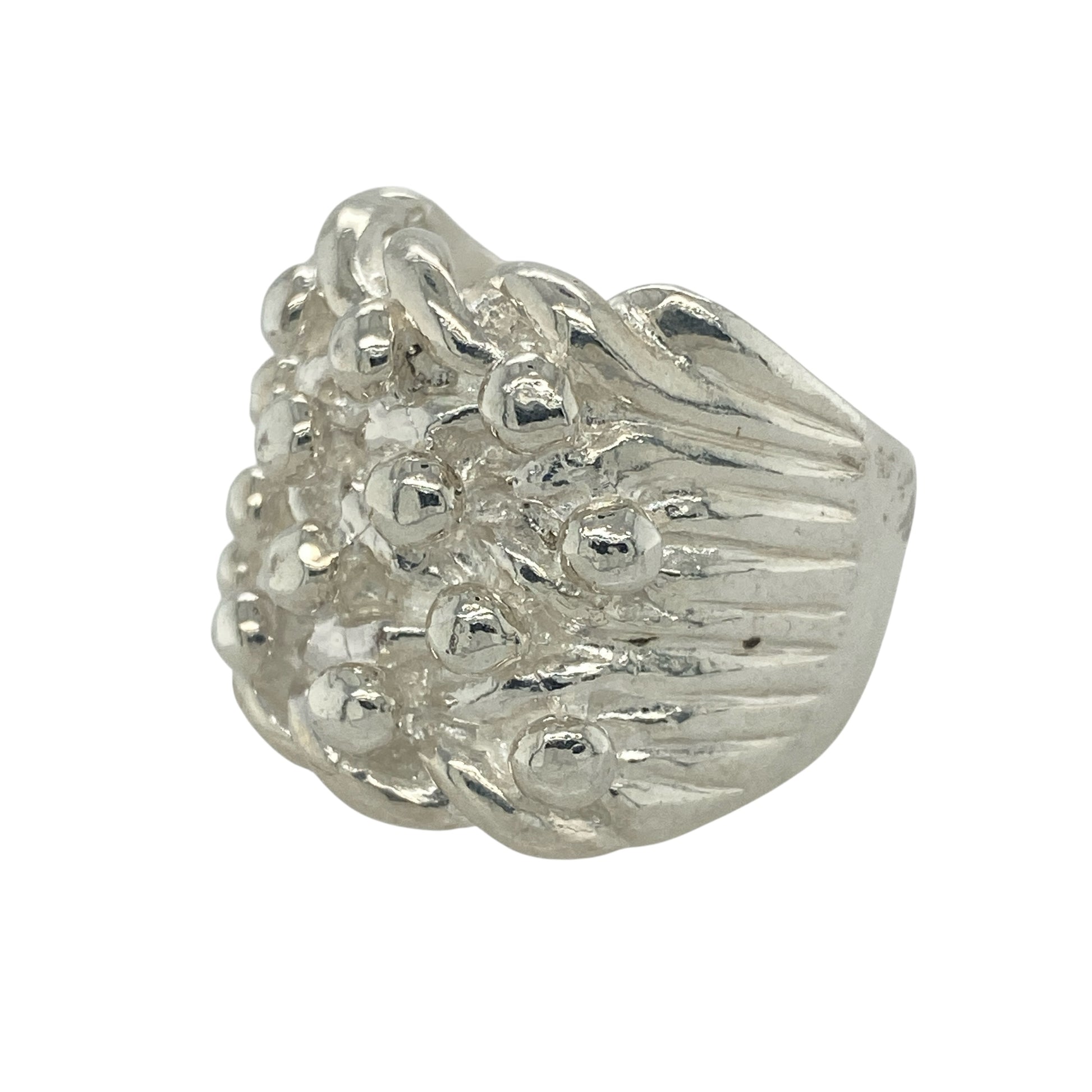 Make a bold impression with this new 925 solid silver four row keeper ring, a heavyweight design with strong presence—perfect for those who love standout jewellery.

Design: The ring showcases four raised rows across the front, measuring 22mm high, creating a striking and powerful look.
Material: Made from solid 925 sterling silver, the polished finish enhances durability while highlighting the bold keeper style.