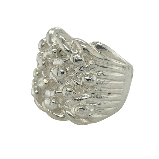 Make a bold impression with this new 925 solid silver four row keeper ring, a heavyweight design with strong presence—perfect for those who love standout jewellery.

Design: The ring showcases four raised rows across the front, measuring 22mm high, creating a striking and powerful look.
Material: Made from solid 925 sterling silver, the polished finish enhances durability while highlighting the bold keeper style.