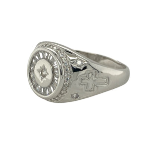 Add modern sparkle to your collection with this new 925 silver cubic zirconia signet ring, a sleek design with symbolic detailing—perfect for everyday wear or statement occasions.

Design: The ring features a 14mm high front set with multiple cubic zirconia stones, while the shoulders are decorated with cross symbols for added character and meaning.
Material: Made from 925 sterling silver, the polished finish enhances durability and complements the brilliance of the stones.