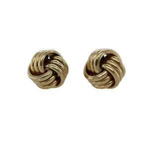 Bring timeless style and bold detail to your collection with these pre-owned 9ct yellow gold knot stud earrings—a classic design with a polished finish.

Design: Each earring showcases a 14mm knot design, offering texture and dimension for a statement look.
Material: Made from 9-carat yellow gold, the warm tone and shine highlight the intricate knot pattern.
Earring Detail: The larger size of the studs makes them a striking yet versatile accessory, suitable for both everyday wear and special occasions.