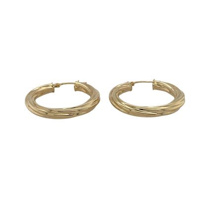 Bring classic style and subtle detail to your collection with these pre-owned 9ct yellow gold twisted hoop creole earrings—a timeless choice for everyday elegance.

Design: Each earring features a traditional creole hoop with a gentle twist pattern, adding texture and interest to the classic shape.
Material: Made from 9-carat yellow gold, the polished finish enhances the warm tone and complements the twisted design.