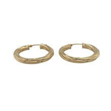 Load image into Gallery viewer, Bring classic style and subtle detail to your collection with these pre-owned 9ct yellow gold twisted hoop creole earrings—a timeless choice for everyday elegance.

Design: Each earring features a traditional creole hoop with a gentle twist pattern, adding texture and interest to the classic shape.
Material: Made from 9-carat yellow gold, the polished finish enhances the warm tone and complements the twisted design.

