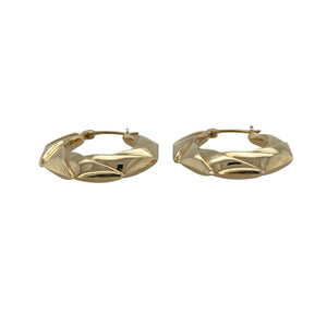 Bring geometric flair and classic elegance to your collection with these pre-owned 9ct yellow gold twisted octagon creole earrings—a stylish twist on a timeless design.

Design: Each earring features an octagon-shaped creole hoop with a subtle twisted pattern, combining structure with decorative detail.
Material: Made from 9-carat yellow gold, the polished finish enhances the warm tone and complements the unique shape.