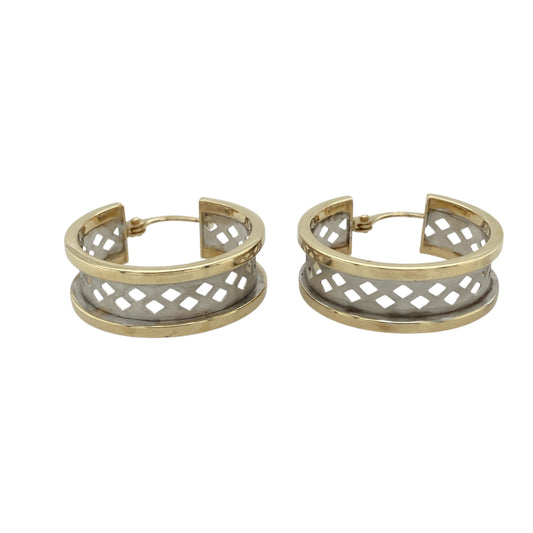 Bring contrast and elegant detail to your collection with these pre-owned 9ct yellow and white gold open weave creole earrings—a refined design with timeless appeal.

Design: Each earring features an open weave hoop pattern, blending yellow and white gold for a textured and eye-catching look.
Material: Made from 9-carat yellow and white gold, the brushed finish enhances the interplay of tones and highlights the intricate weave.