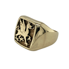 Load image into Gallery viewer, Bring heritage and bold detail to your collection with this pre-owned 9ct yellow gold Welsh dragon signet ring—a striking design with symbolic character.

Design: The ring features a detailed Welsh dragon motif on the front, measuring 14mm high, offering a proud and distinctive look.
Material: Made from 9-carat yellow gold, the polished finish enhances the warm tone and highlights the dragon design.
