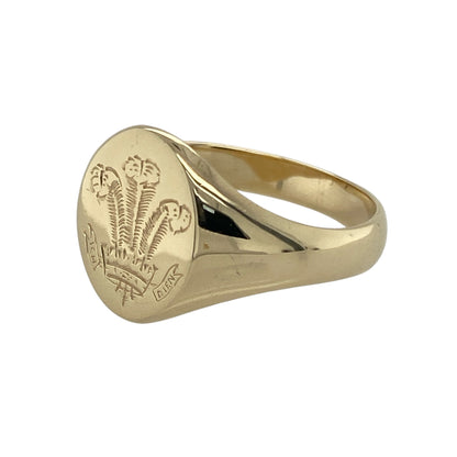 Bring heritage and distinctive style to your collection with this pre-owned 9ct yellow gold Welsh three feathers signet ring—a meaningful design with timeless appeal.

Design: The ring features an oval face measuring 15mm high, engraved with the iconic Welsh three feathers motif for a bold and traditional look.
Material: Made from 9-carat yellow gold, the polished finish enhances the warm tone and highlights the detailed emblem.