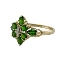 Load image into Gallery viewer, Bring vibrant colour and floral elegance to your collection with this pre-owned 9ct yellow gold diamond and green stone flower ring—a striking design with timeless charm.

Design: The ring features a 15mm high floral arrangement of vivid green stones accented by sparkling diamonds, creating a bold and eye-catching display.
Material: Made from 9-carat yellow gold, the polished finish enhances the warm tone and complements the brilliance of the stones.
