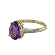 Load image into Gallery viewer, Bring rich colour and elegant sparkle to your collection with this pre-owned 9ct yellow gold diamond and amethyst ring—a timeless design with refined detail.

Design: The ring features a striking 10mm by 7mm teardrop-shaped amethyst at its centre, complemented by sparkling diamonds set along the shoulders for added brilliance.
Material: Made from 9-carat yellow gold, the polished finish enhances the warm tone and contrasts beautifully with the vivid purple of the amethyst.
