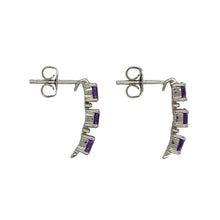 Load image into Gallery viewer, Bring vibrant colour and refined sparkle to your collection with these pre-owned 9ct white gold amethyst and diamond drop stud earrings—a graceful design with timeless charm.

Design: Each earring features three oval amethyst stones measuring 4mm by 3mm, arranged vertically with a small diamond set between each stone for added brilliance.
Material: Made from 9-carat white gold, the polished finish enhances the bright tone and beautifully complements the rich purple of the amethysts.
