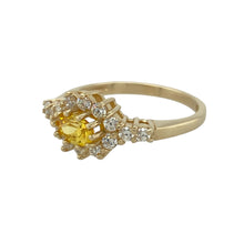Load image into Gallery viewer, Bring colour and sparkle to your collection with this pre-owned 9ct yellow gold cluster ring, showcasing a vibrant mix of white and yellow cubic zirconia for a bold and eye-catching design.

Design: The ring features a 4mm by 6mm oval yellow cubic zirconia at the centre, surrounded by a cluster of smaller yellow stones, with white accents enhancing the overall brilliance.
Material: Made from 9-carat yellow gold, the polished finish complements the golden tones of the stones for a radiant effect.

