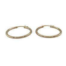 Load image into Gallery viewer, Bring classic simplicity and everyday style to your collection with these pre-owned 9ct yellow gold hoop earrings, designed in a timeless creole shape.

Design: Each earring features a smooth and polished plain hoop in a traditional creole style, offering effortless wearability.
Material: Made from 9-carat yellow gold, the polished finish enhances the warm tone and shine.
Earring Detail: Lightweight and versatile, these hoops are perfect for daily wear while adding a touch of gold elegance.
