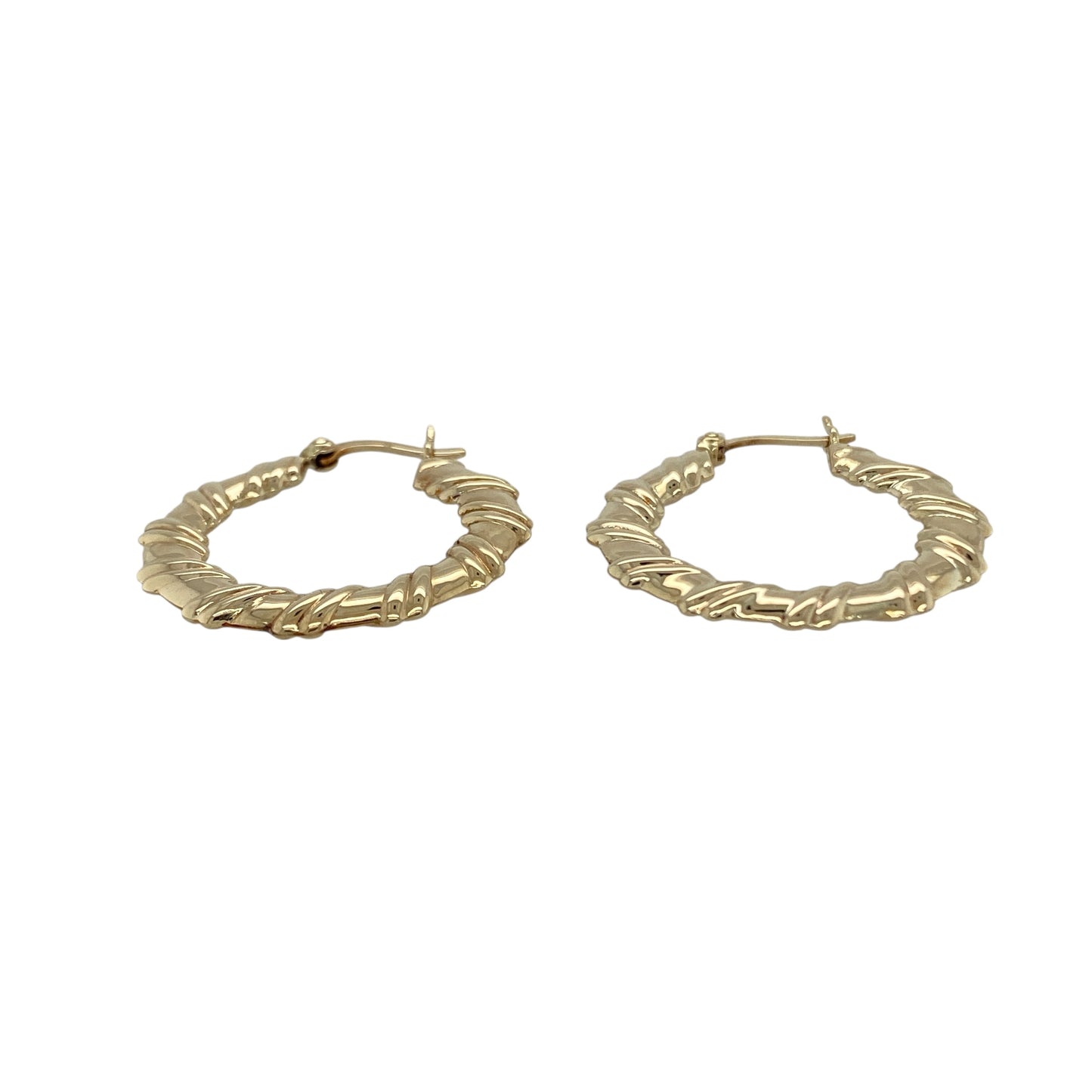 Bring texture and timeless style to your collection with these pre-owned 9ct yellow gold hoop earrings, designed in a twisted flat creole shape for added elegance.

Design: Each earring features a flat hoop with a subtle twist, creating a refined look that catches the light beautifully.
Material: Made from 9-carat yellow gold, the polished finish enhances the warm golden tone and shine.
Earring Detail: The creole style ensures secure wear while the twisted design adds a touch of modern sophistication.