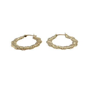 Bring texture and timeless style to your collection with these pre-owned 9ct yellow gold hoop earrings, designed in a twisted flat creole shape for added elegance.

Design: Each earring features a flat hoop with a subtle twist, creating a refined look that catches the light beautifully.
Material: Made from 9-carat yellow gold, the polished finish enhances the warm golden tone and shine.
Earring Detail: The creole style ensures secure wear while the twisted design adds a touch of modern sophistication.