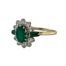Load image into Gallery viewer, Bring vibrant colour and sparkling detail to your collection with this pre-owned 9ct yellow gold cluster ring, designed with an emerald-coloured centre stone framed by cubic zirconia and accented with green shoulder stones.

Design: The ring showcases an 8mm by 6mm oval green stone at the centre, surrounded by a halo of cubic zirconia, with rectangular green stones set into each shoulder for added depth and balance.
