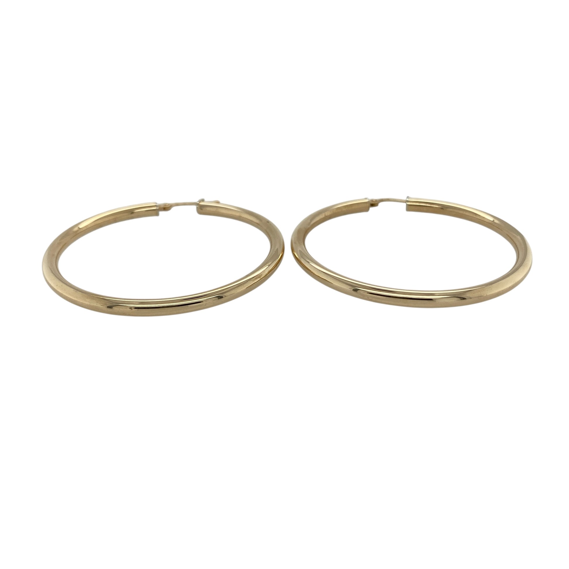 Bring classic simplicity and timeless shine to your collection with these pre-owned 9ct yellow gold hoop earrings, styled in a traditional creole design.

Design: Each earring features a smooth, polished hoop for an elegant and versatile look.
Material: Made from 9-carat yellow gold, the polished finish enhances the warm tone and reflective shine.
Earring Detail: The creole style ensures secure and comfortable wear, making them ideal for daily use.