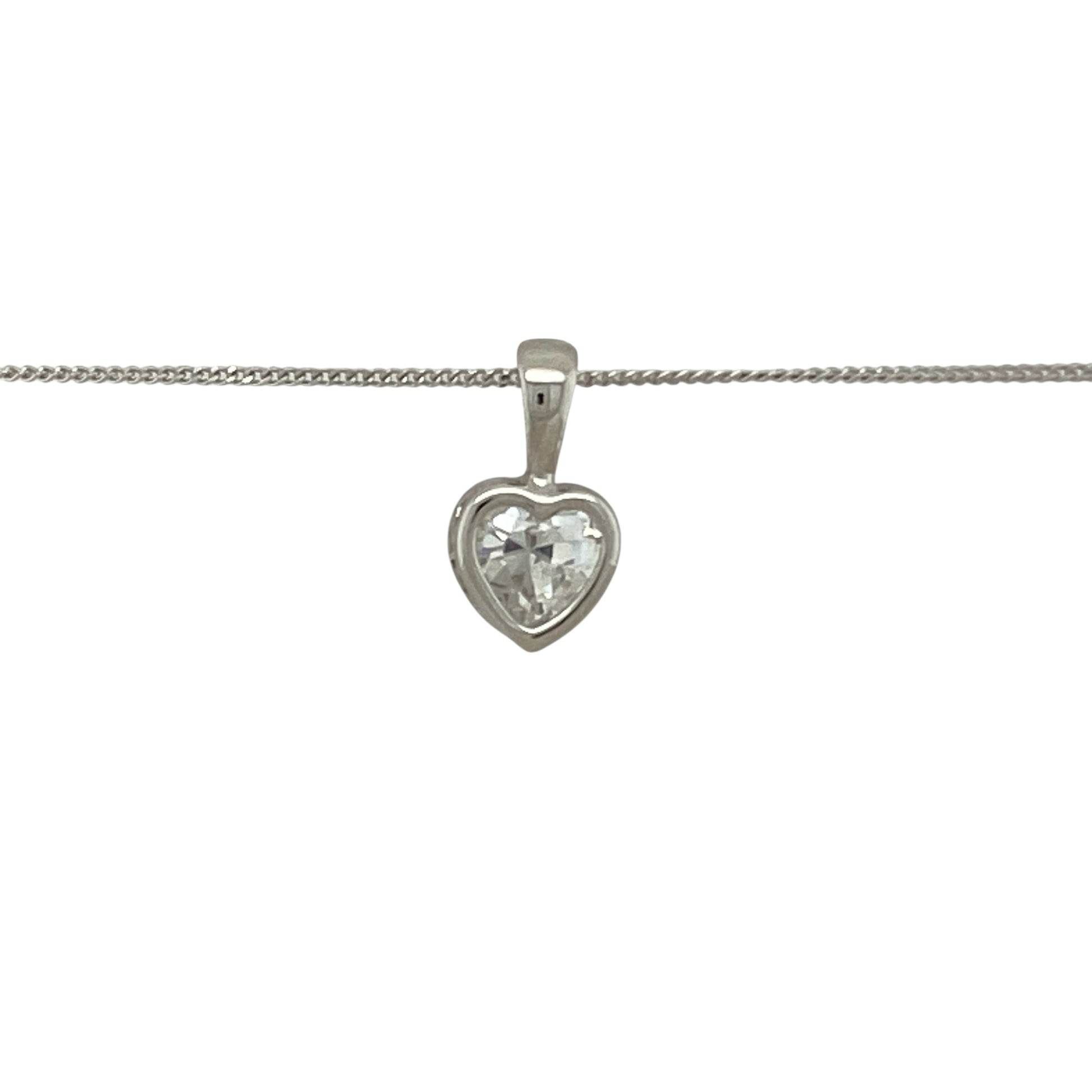 Bring delicate sparkle and modern elegance to your collection with this pre-owned 9ct white gold necklace, featuring a cubic zirconia set heart pendant on a fine curb chain.

Design: The pendant measures 1.2cm long including the bail and is styled as a heart motif set with cubic zirconia, adding brilliance and charm.
Material: Made from 9-carat white gold, the polished finish enhances the cool tone and complements the sparkle of the stones.