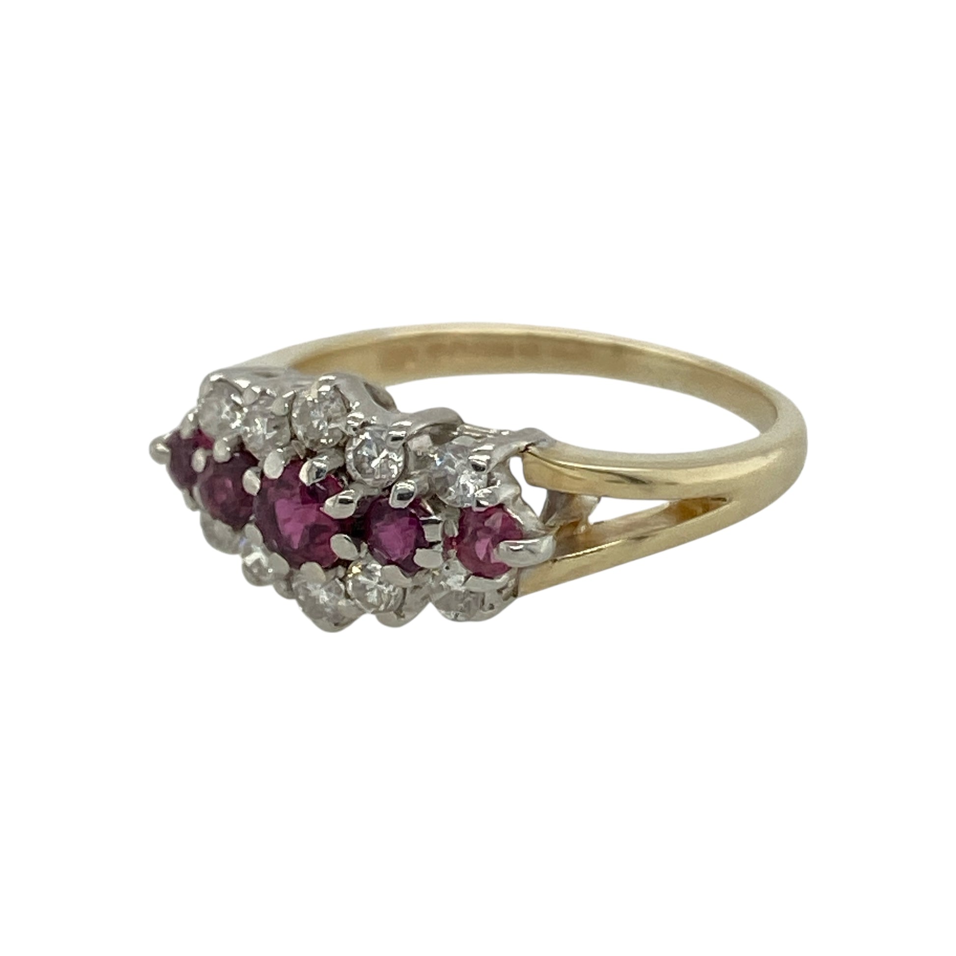 Bring vibrant colour and refined sparkle to your collection with this pre-owned 9ct yellow gold cluster ring, designed with rubies and diamonds in a classic arrangement.

Design: The front of the ring measures 8mm high and features five rubies set across the centre, framed by rows of diamonds above and below for balance and brilliance.
Material: Made from 9-carat yellow gold, the polished finish enhances the warm tone and complements the rich red rubies and bright diamonds.
