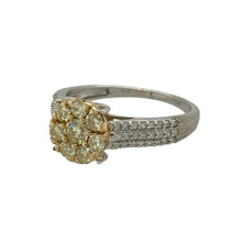 Load image into Gallery viewer, Bring unique sparkle and floral-inspired elegance to your collection with this pre-owned 9ct white gold cluster ring, featuring champagne and white diamonds in a striking design.

Design: The centre showcases a flower-shaped cluster of champagne diamonds set in yellow gold, totalling approximately 0.63ct, while the white gold shoulders are adorned with three rows of sparkling diamonds for added brilliance.
