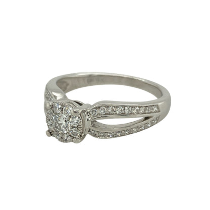 Bring refined sparkle and timeless elegance to your collection with this pre-owned 9ct white gold ring, styled with an illusion-set diamond cluster for maximum brilliance.

Design: The ring features a solitaire-style cluster of diamonds arranged in an illusion setting, giving the appearance of a larger central stone with a total diamond content of approximately 0.35ct.