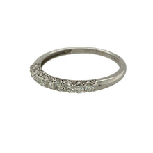 Load image into Gallery viewer, Bring subtle sparkle and timeless elegance to your collection with this pre-owned 9ct white gold band ring, styled with a row of diamonds across the front.

Design: The 2mm wide front of the band is set with diamonds totalling approximately 0.33ct, adding refined brilliance to the sleek design.
Material: Made from 9-carat white gold, the polished finish enhances the cool tone and complements the sparkle of the stones.
