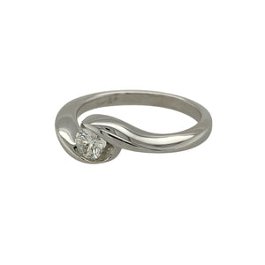 Bring refined sparkle and modern elegance to your collection with this pre-owned 18ct white gold solitaire ring, styled with a brilliant-cut diamond in a graceful twist design.

Design: The ring features a single round brilliant-cut diamond of approximately 0.20ct, held in a twisted setting that adds movement and contemporary charm.
Material: Made from 18-carat white gold, the polished finish enhances the cool tone and provides a luxurious backdrop for the diamond.