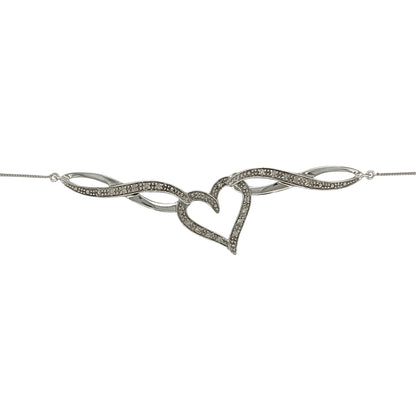 Bring romantic elegance and subtle sparkle to your collection with this pre-owned 9ct white gold necklace, featuring a diamond-set heart swirl pendant on a 20" chain.

Design: The pendant measures 15mm by 15mm and is styled as an open heart with a graceful swirl design, accented with diamonds for added brilliance.
Material: Made from 9-carat white gold, the polished finish enhances the cool tone and complements the sparkle of the stones.